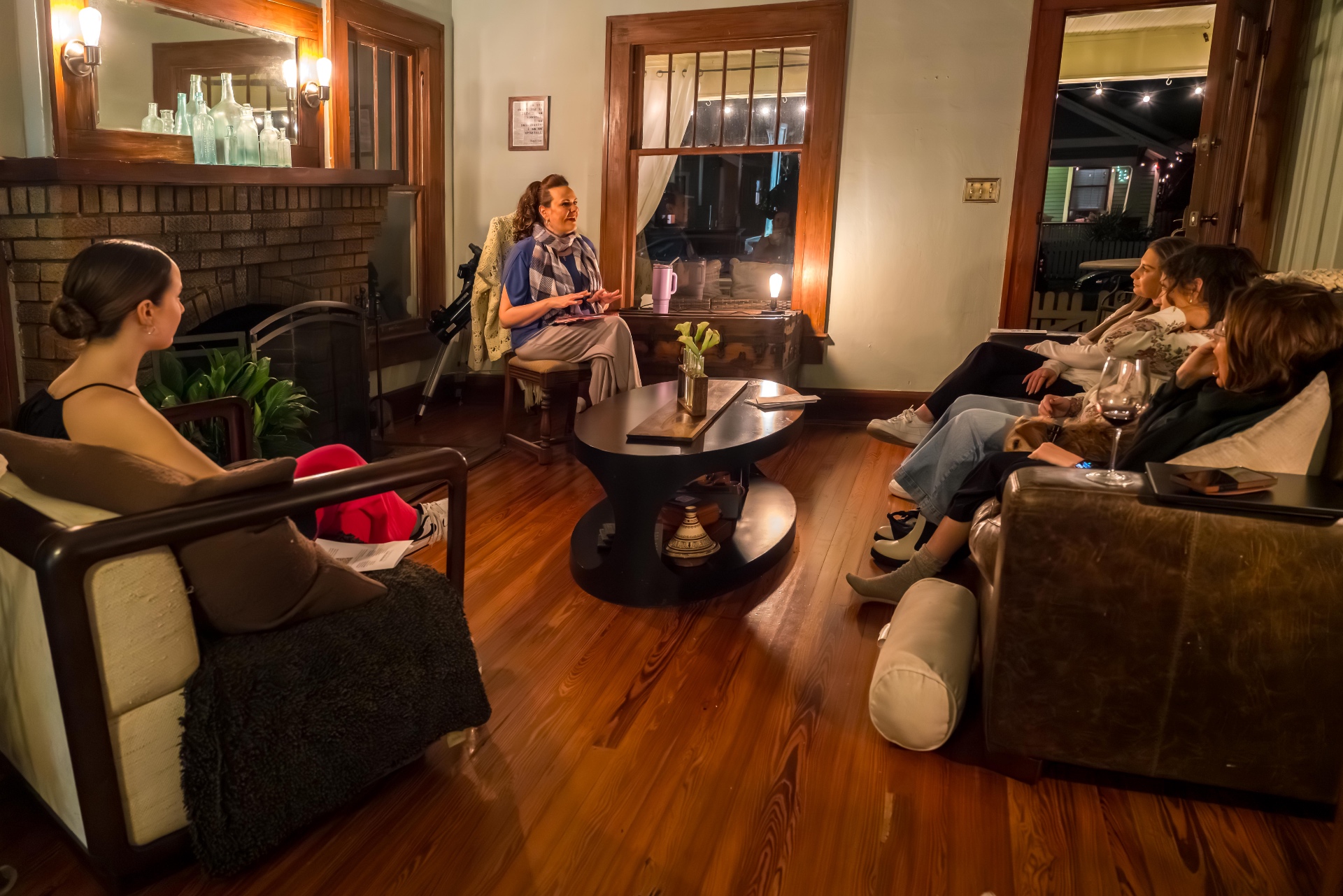 Artists gathered in a living room for a Story Keepers salon reading